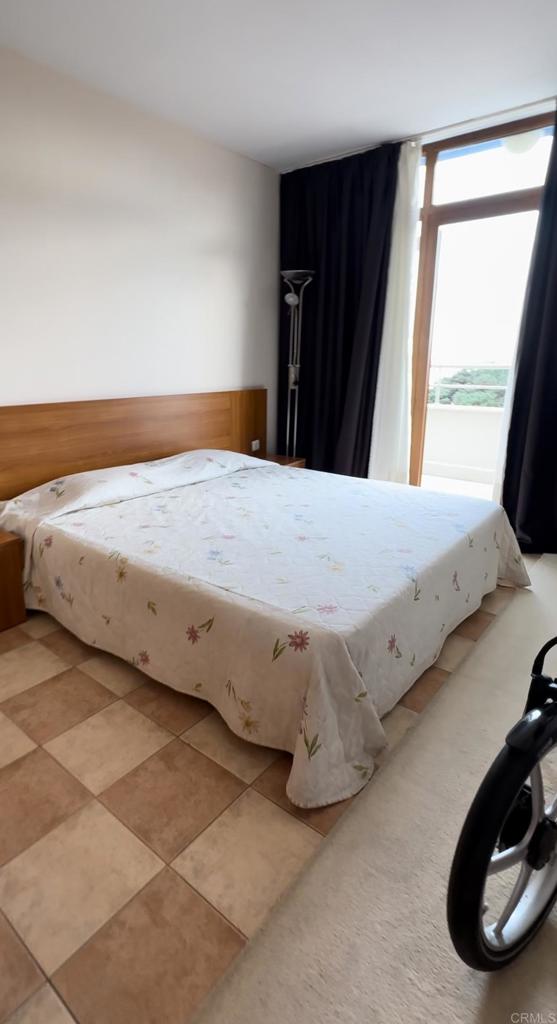 2 Flowers, Unit 51 Absecon, OS 08240 - Photo 17 of 37 a bed sitting in a bedroom next to a window