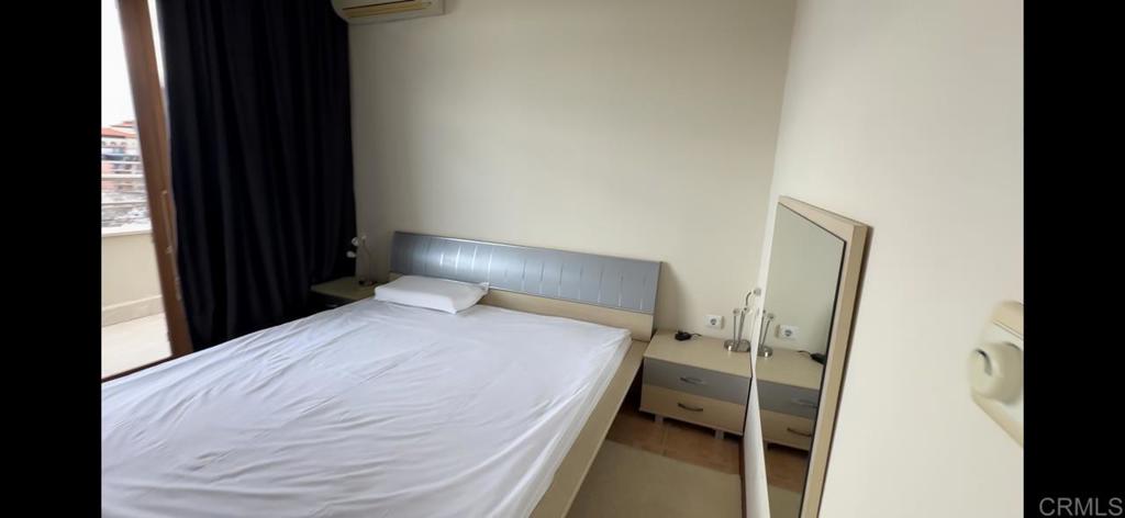 2 Flowers, Unit 51 Absecon, OS 08240 - Photo 21 of 37 a bedroom with a bed and a window