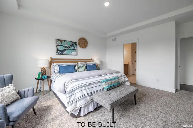 a bedroom with a bed and couch