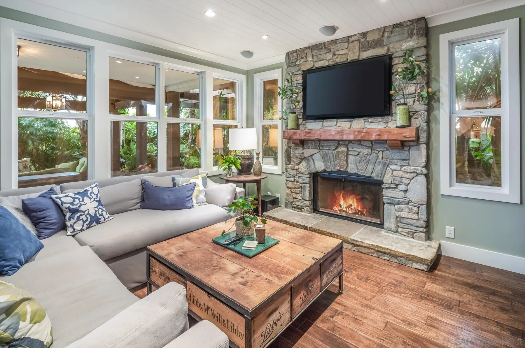 4665 Sunburst Road Carlsbad, CA 92008 - Photo 12 of 29 a living room with furniture a flat screen tv and a fireplace