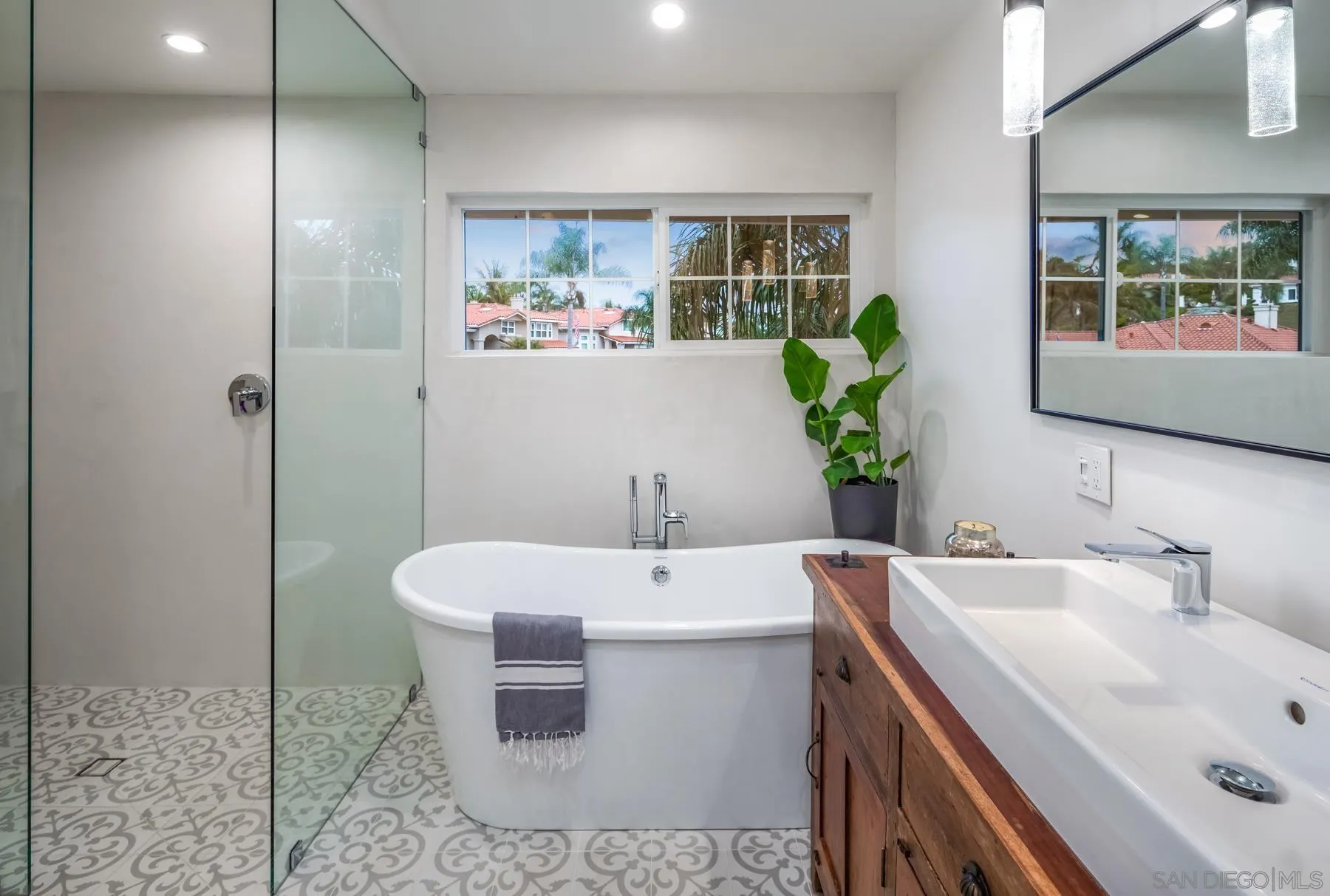 4665 Sunburst Road Carlsbad, CA 92008 - Photo 19 of 29 a bathroom with a sink and mirror