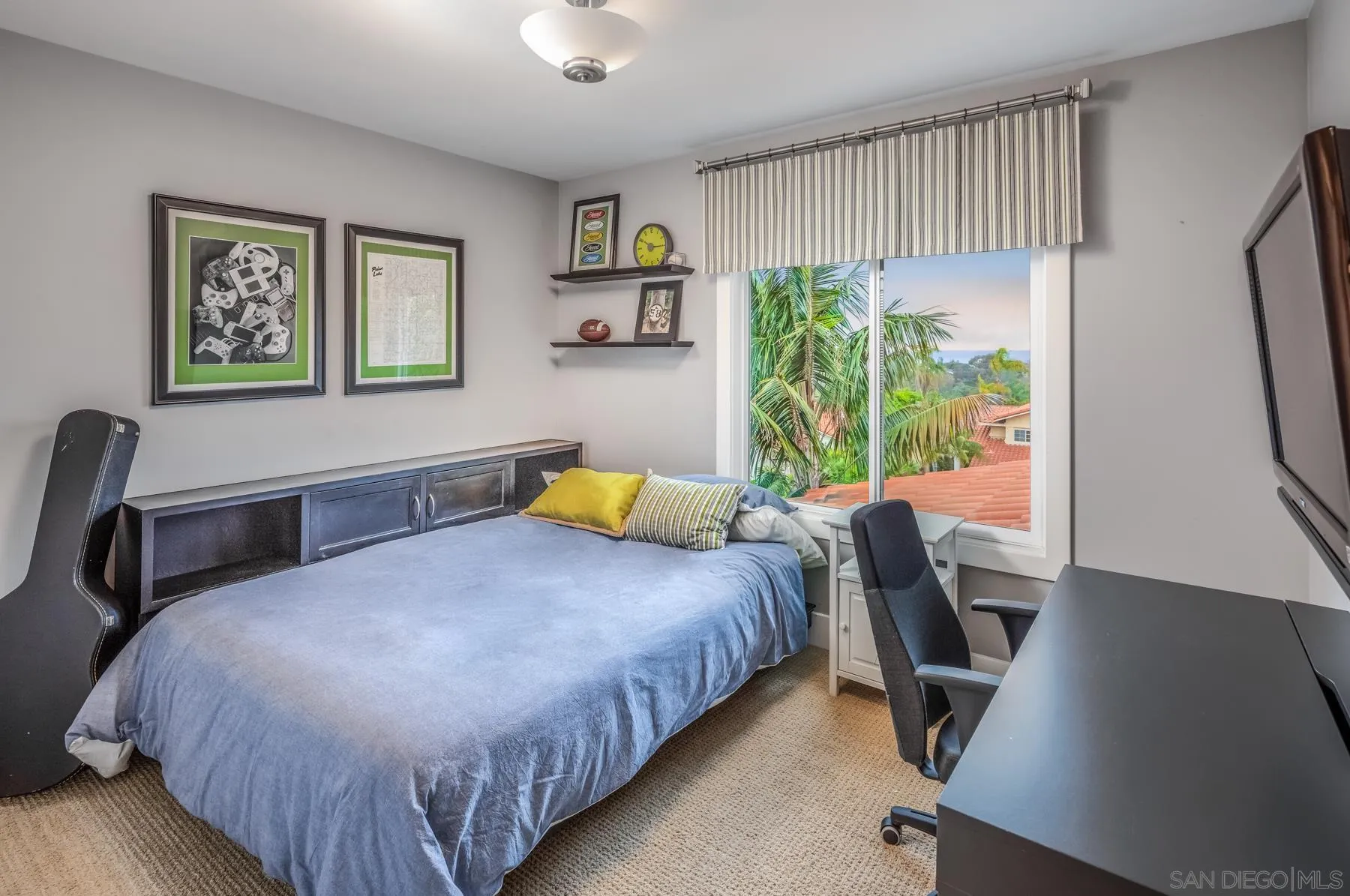 4665 Sunburst Road Carlsbad, CA 92008 - Photo 20 of 29 a bedroom with a bed a desk and chair