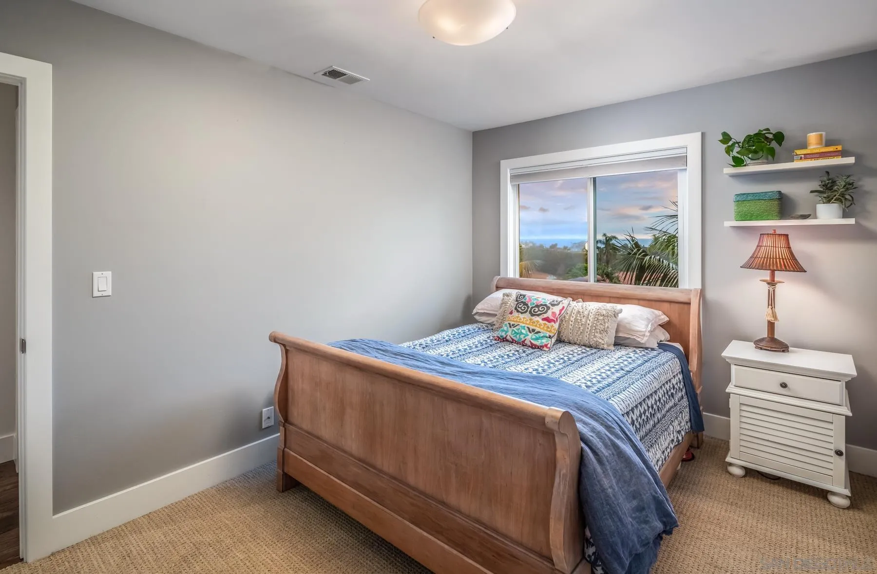 4665 Sunburst Road Carlsbad, CA 92008 - Photo 21 of 29 a bedroom with a bed and a window