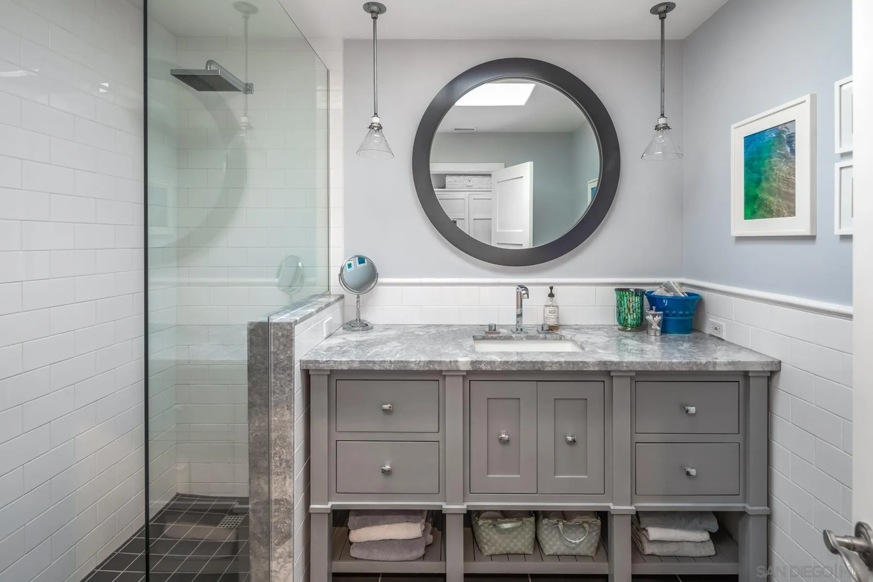 4665 Sunburst Road Carlsbad, CA 92008 - Photo 22 of 29 a bathroom with a granite countertop double vanity sink and a mirror