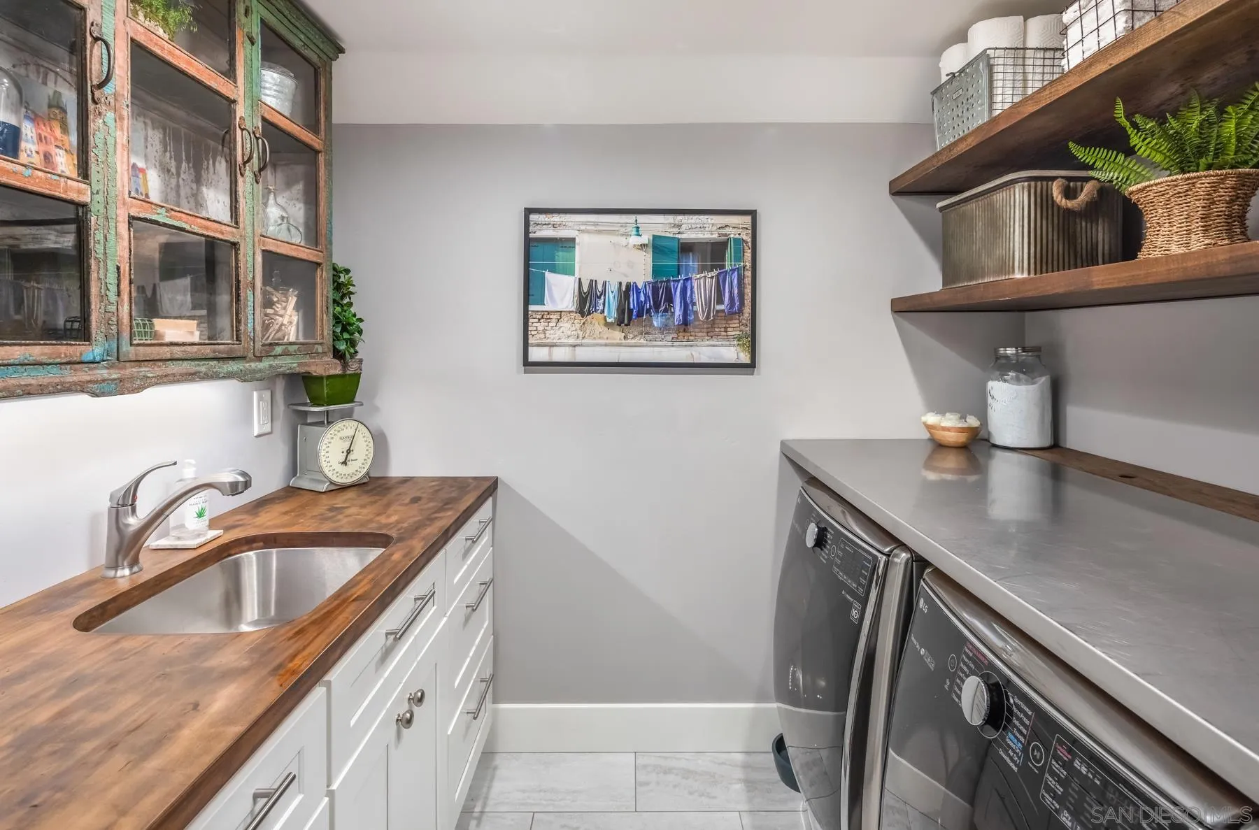 4665 Sunburst Road Carlsbad, CA 92008 - Photo 23 of 29 a kitchen with a sink a stove and cabinets