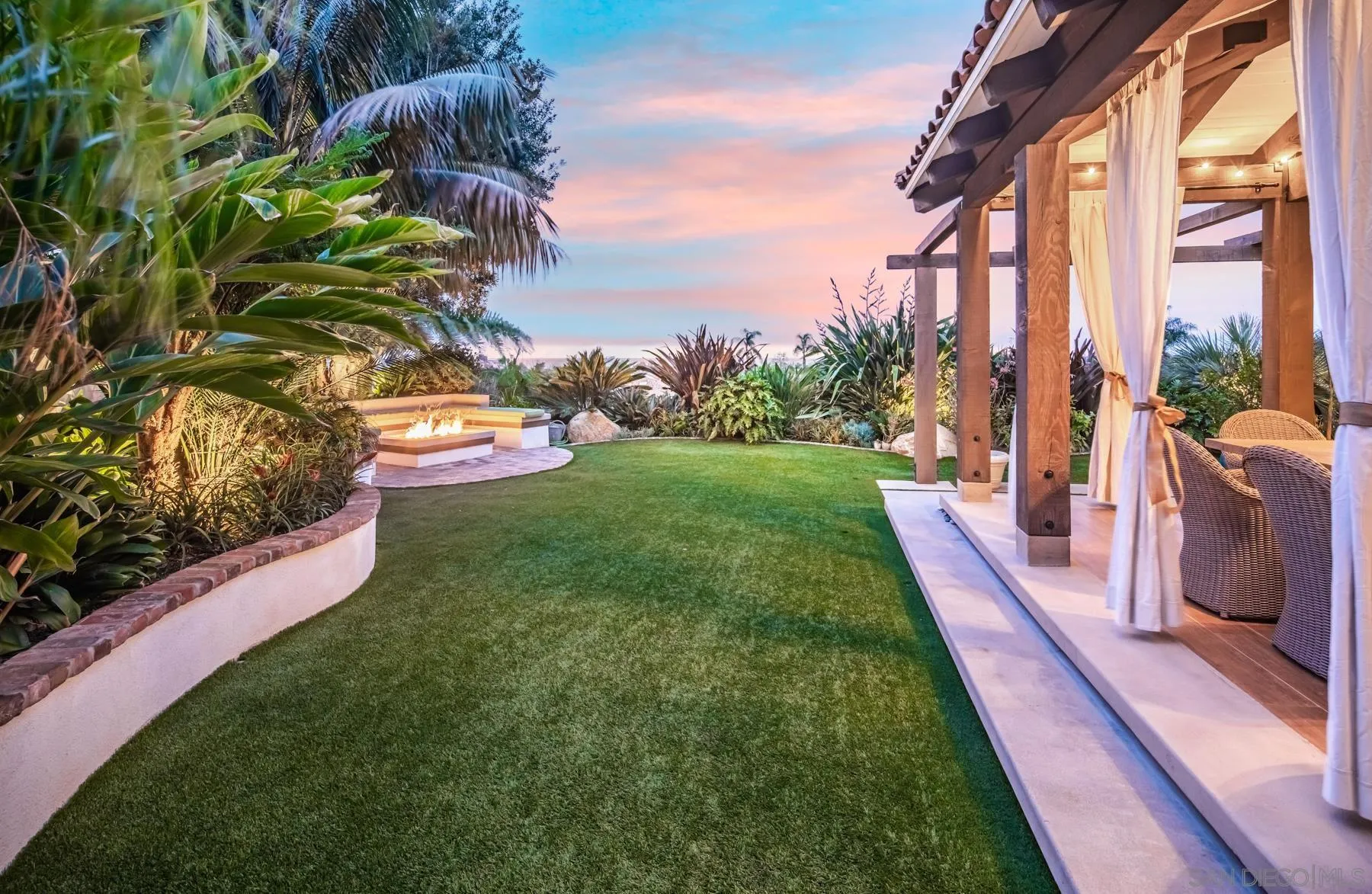 4665 Sunburst Road Carlsbad, CA 92008 - Photo 25 of 29 a view of a garden with lawn chairs