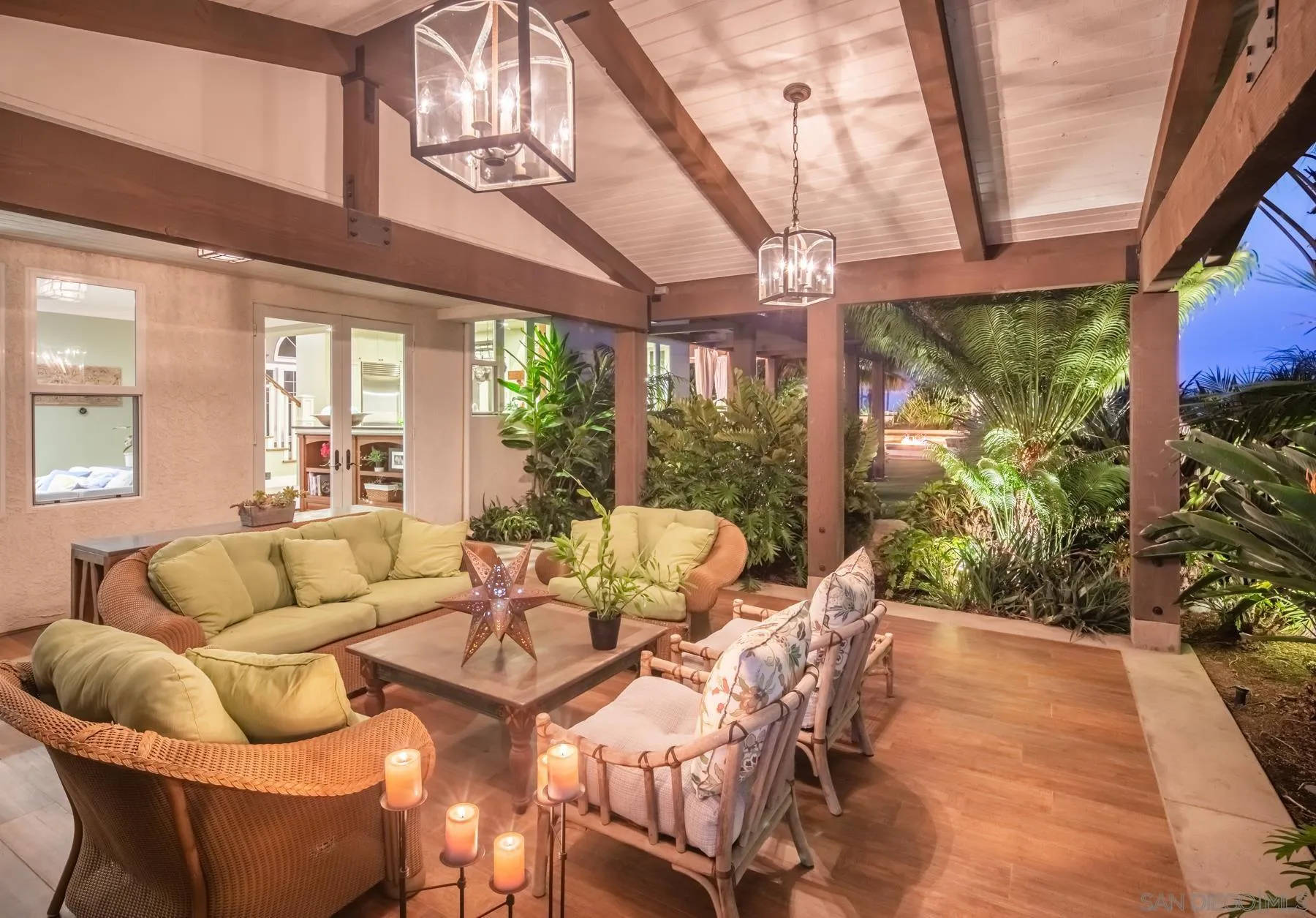 4665 Sunburst Road Carlsbad, CA 92008 - Photo 27 of 29 a living room with patio furniture and a floor to ceiling windows