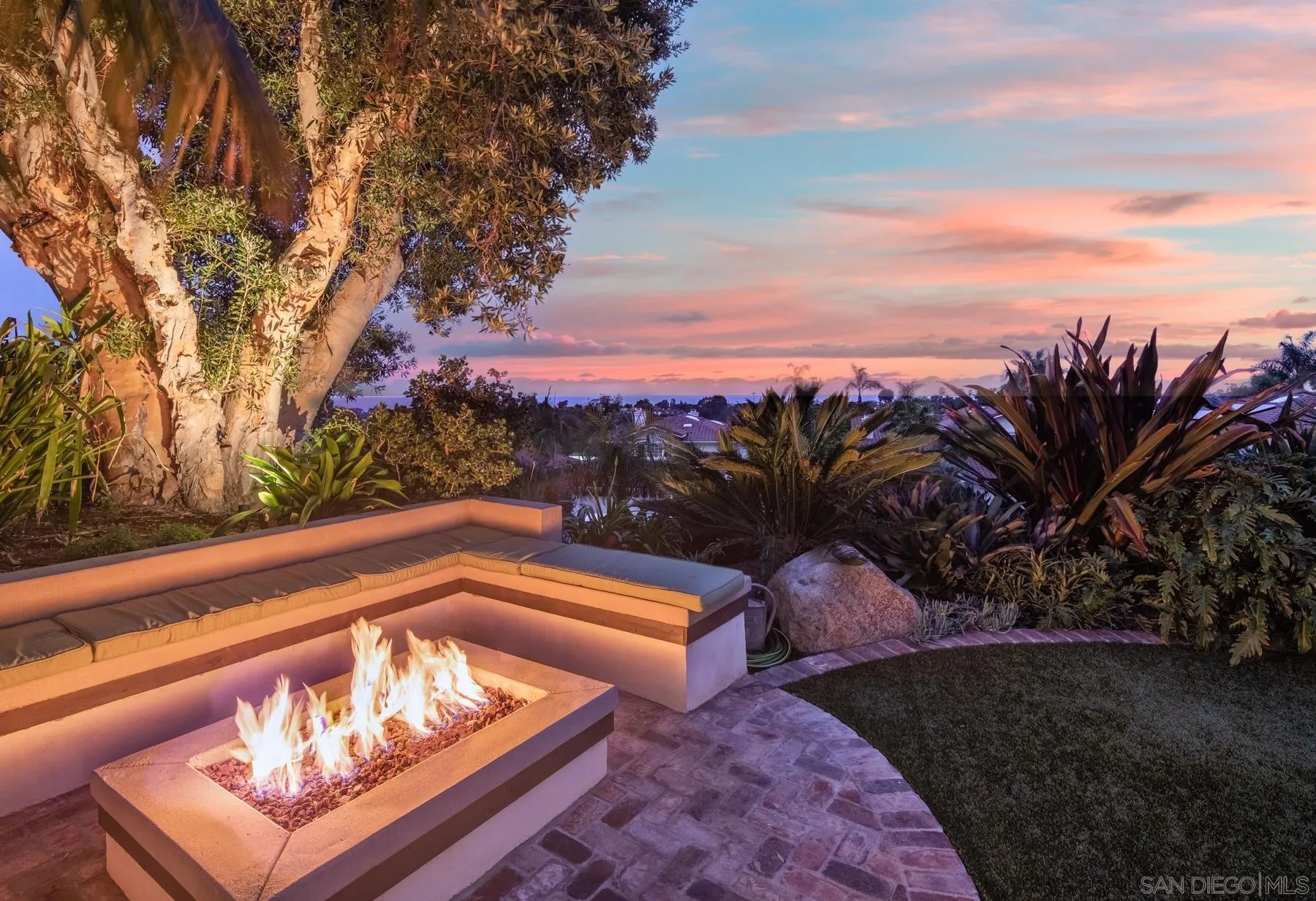 4665 Sunburst Road Carlsbad, CA 92008 - Photo 3 of 29 a view of a bench in a backyard