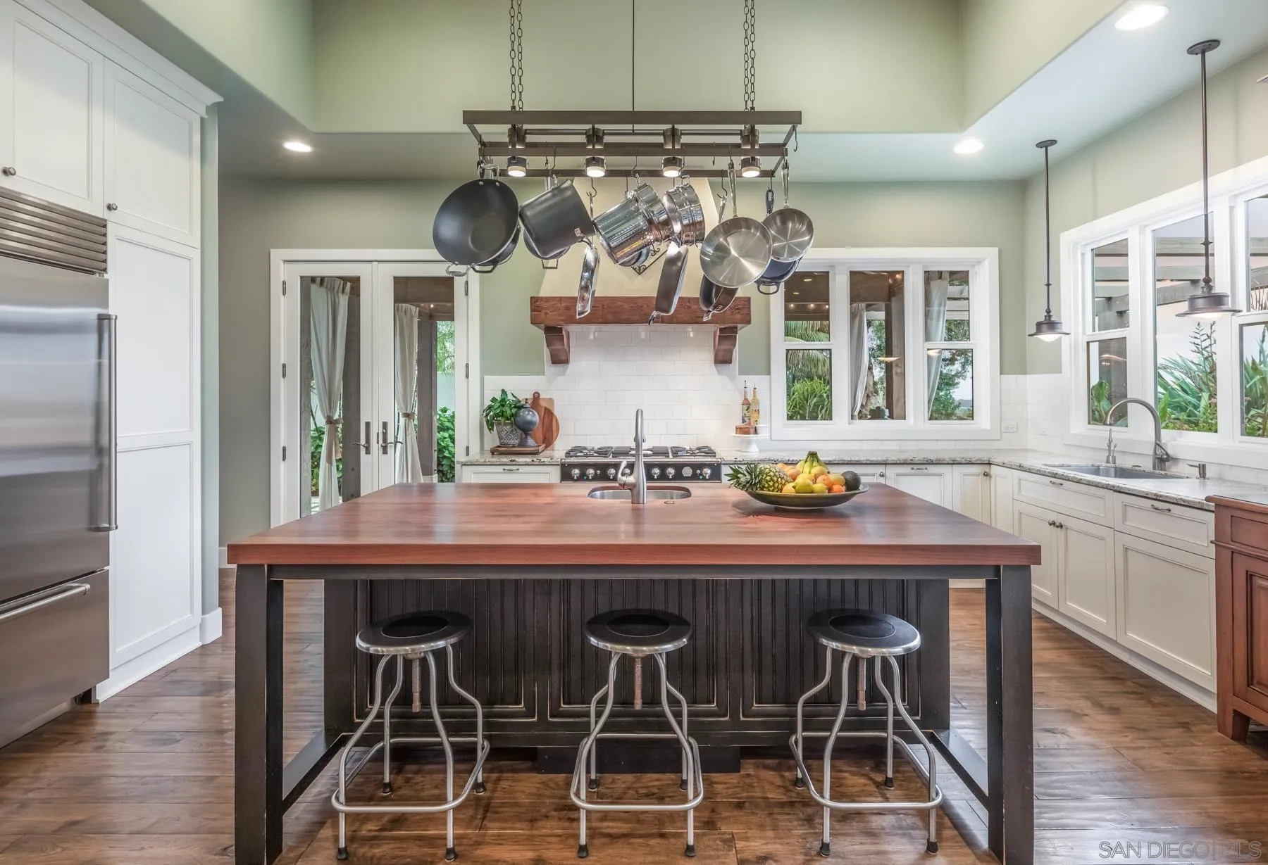 4665 Sunburst Road Carlsbad, CA 92008 - Photo 7 of 29 a kitchen with a table and chairs in it