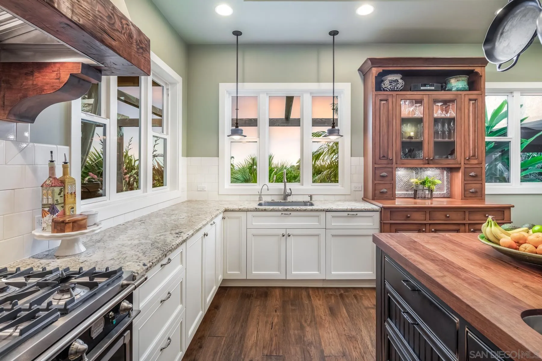 4665 Sunburst Road Carlsbad, CA 92008 - Photo 8 of 29 a kitchen with stainless steel appliances granite countertop a stove and a sink
