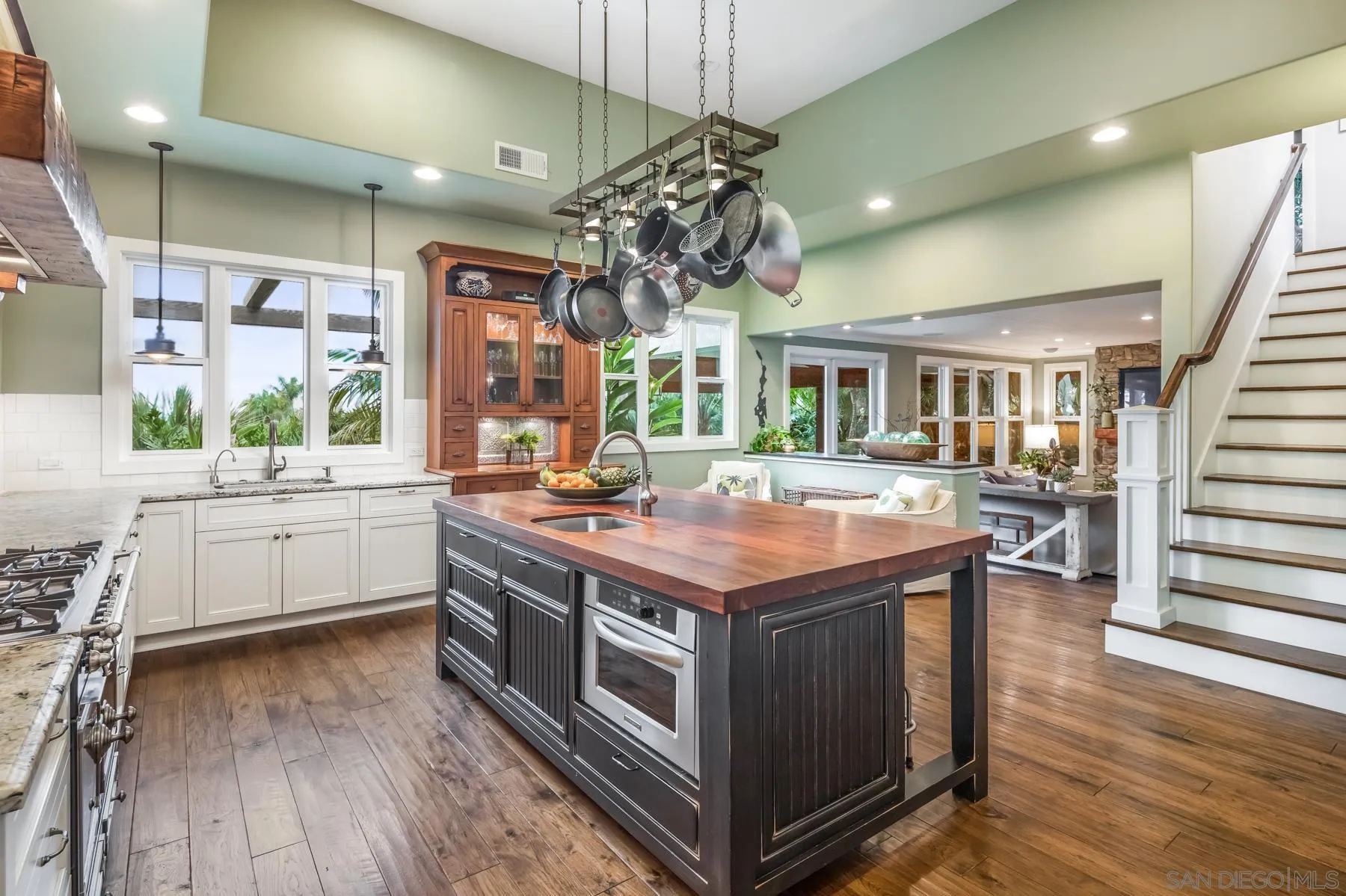 4665 Sunburst Road Carlsbad, CA 92008 - Photo 10 of 29 a kitchen with a stove and a wooden floor
