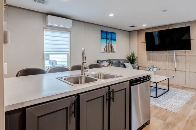 a kitchen with a sink and a microwave