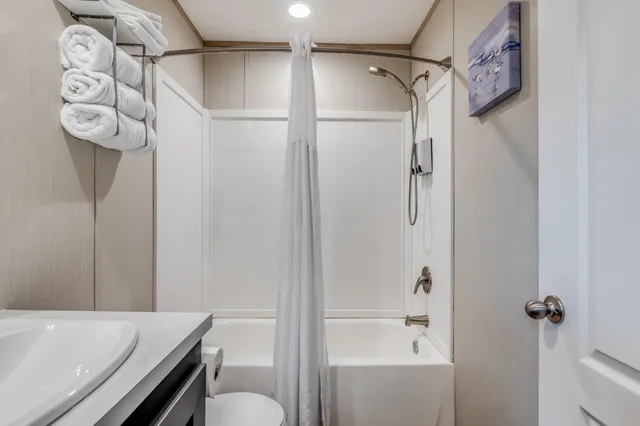 a bathroom with a shower and a toilet