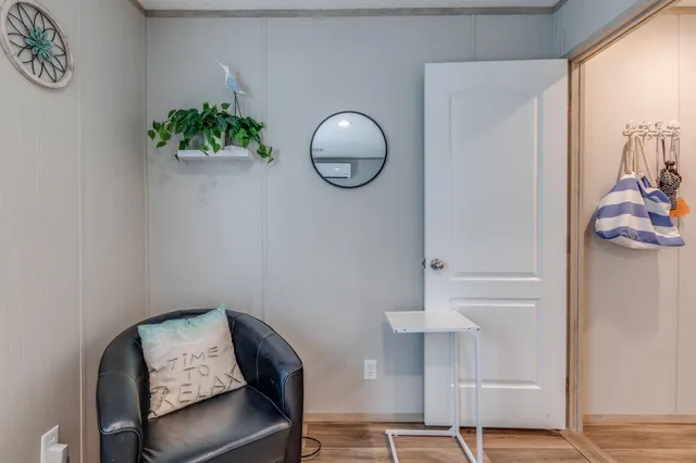 a room with a table and a potted plant