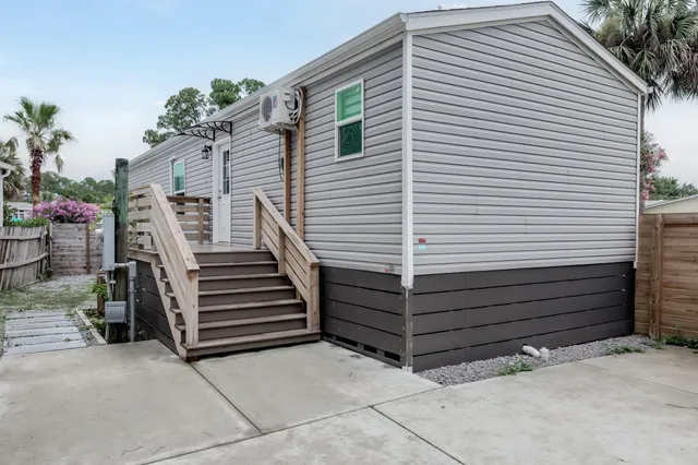 a view of a house with a door and a ceiling fan