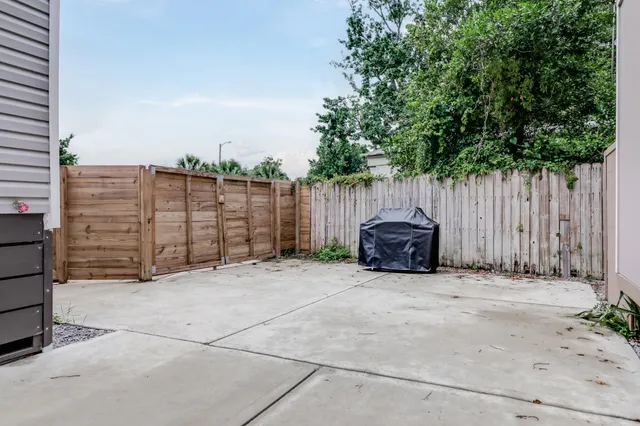 a view of outdoor space with wooden fence