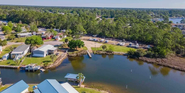 an aerial view of a house with a lake view