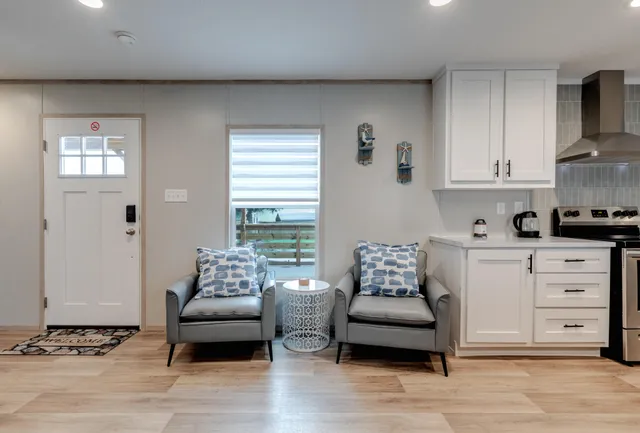 a living room with furniture and night stand