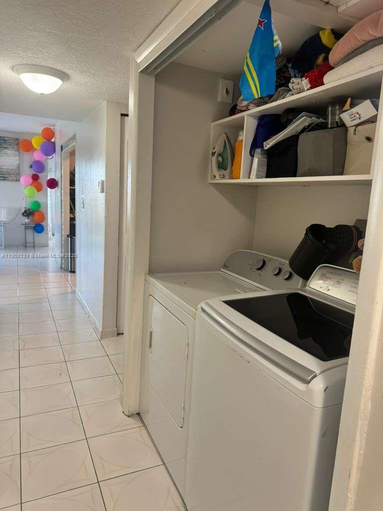 4164 Inverrary Drive, Unit 601 Lauderhill, FL 33319 - Photo 17 of 23 a utility room with dryer and washer