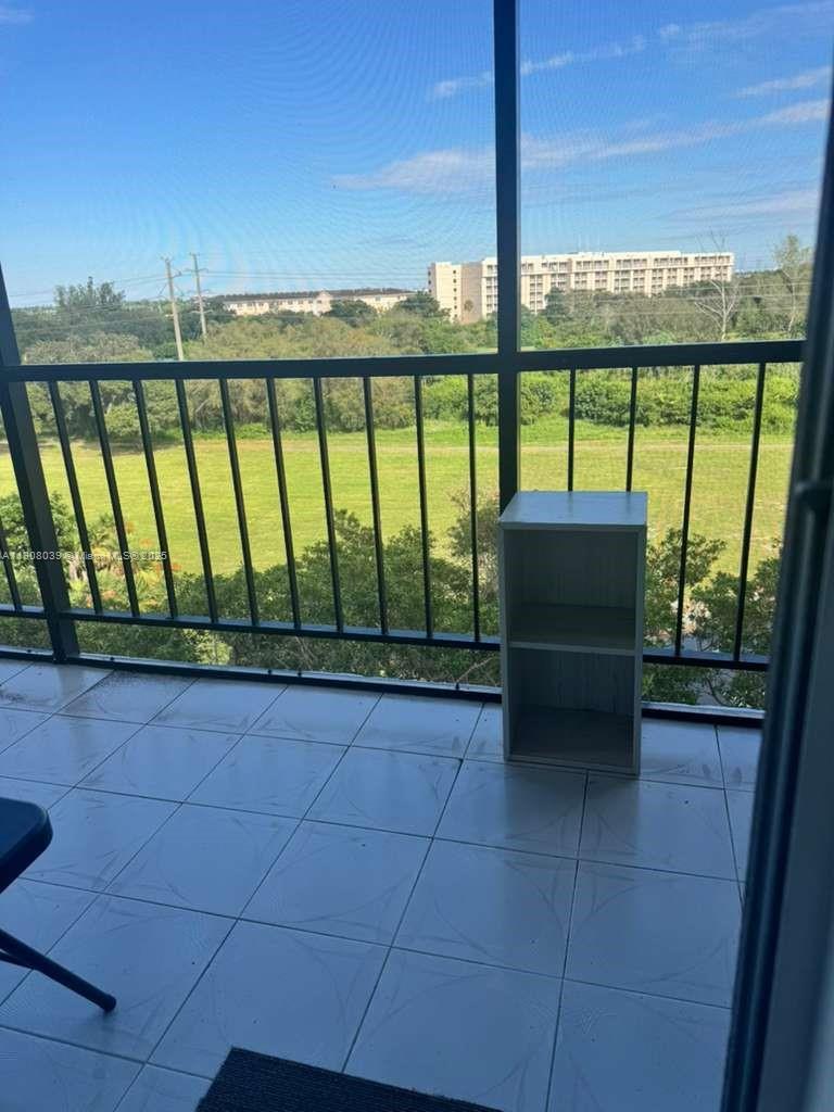 4164 Inverrary Drive, Unit 601 Lauderhill, FL 33319 - Photo 19 of 23 a view of a chairs and table in patio