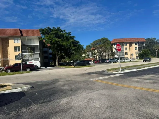 a view of street with parked cars
