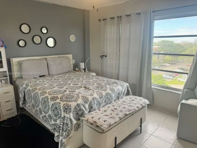 a bedroom with a bed and a table