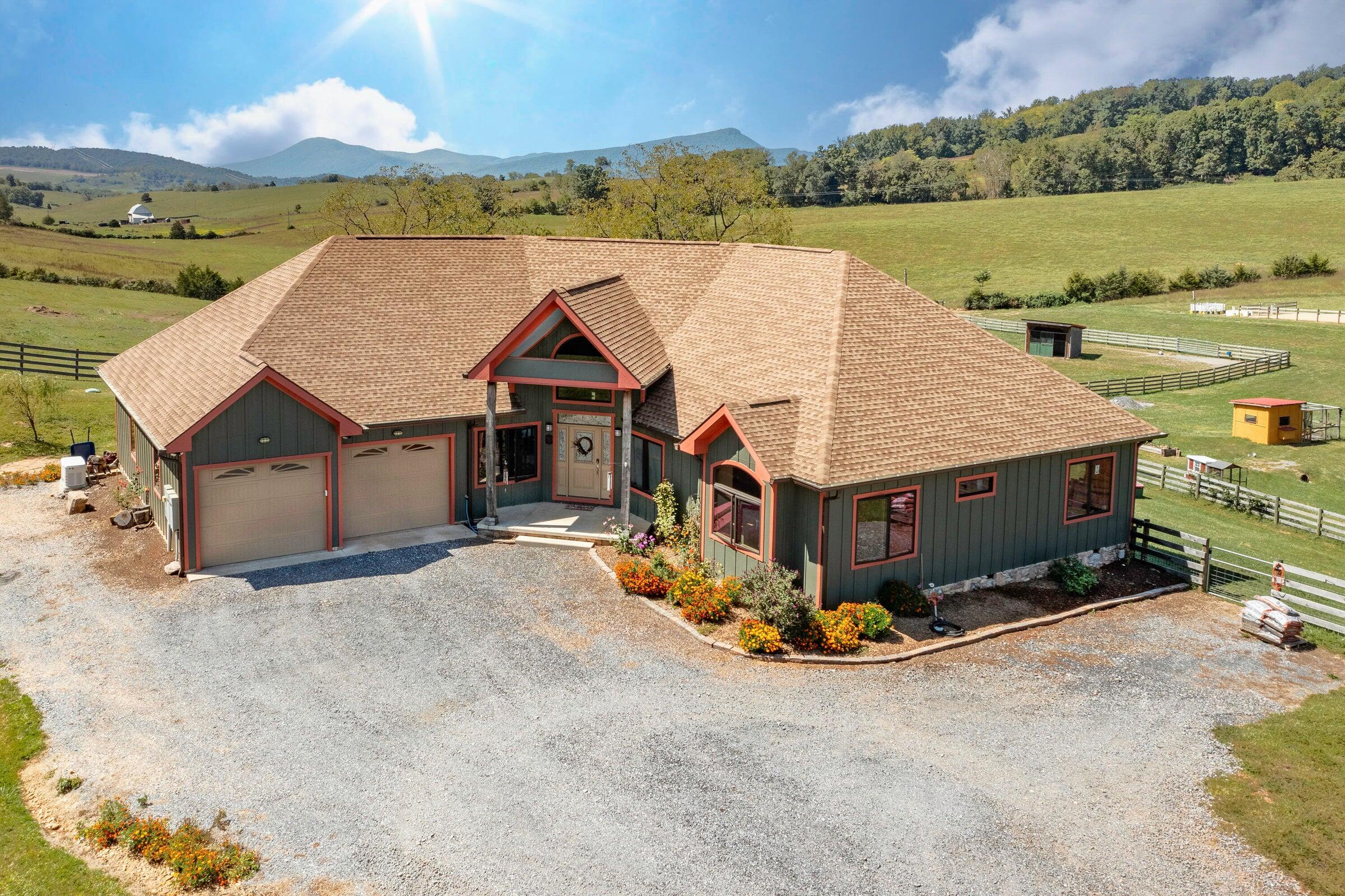 747 New Providence Road Raphine, VA 24472 - Photo 13 of 46 an aerial view of a house with big yard and large tree