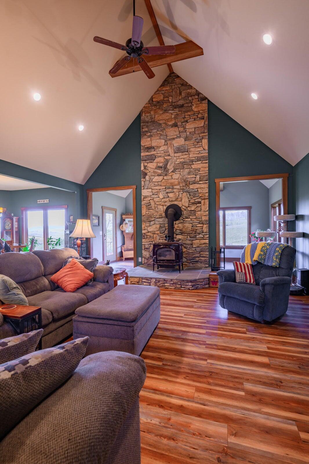 747 New Providence Road Raphine, VA 24472 - Photo 15 of 46 a living room with furniture and a fireplace