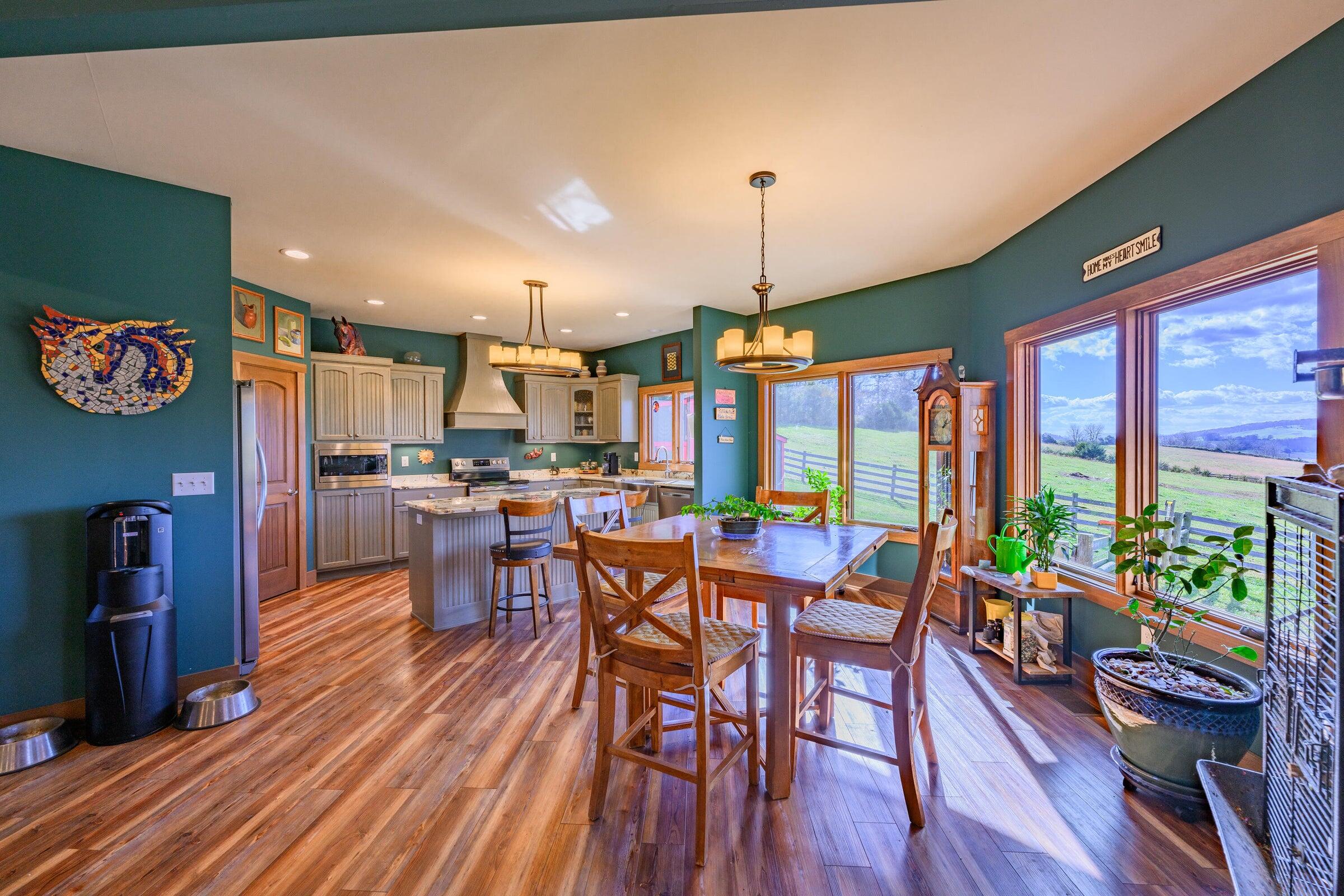 747 New Providence Road Raphine, VA 24472 - Photo 20 of 46 a view of a dining room with furniture window and wooden floor