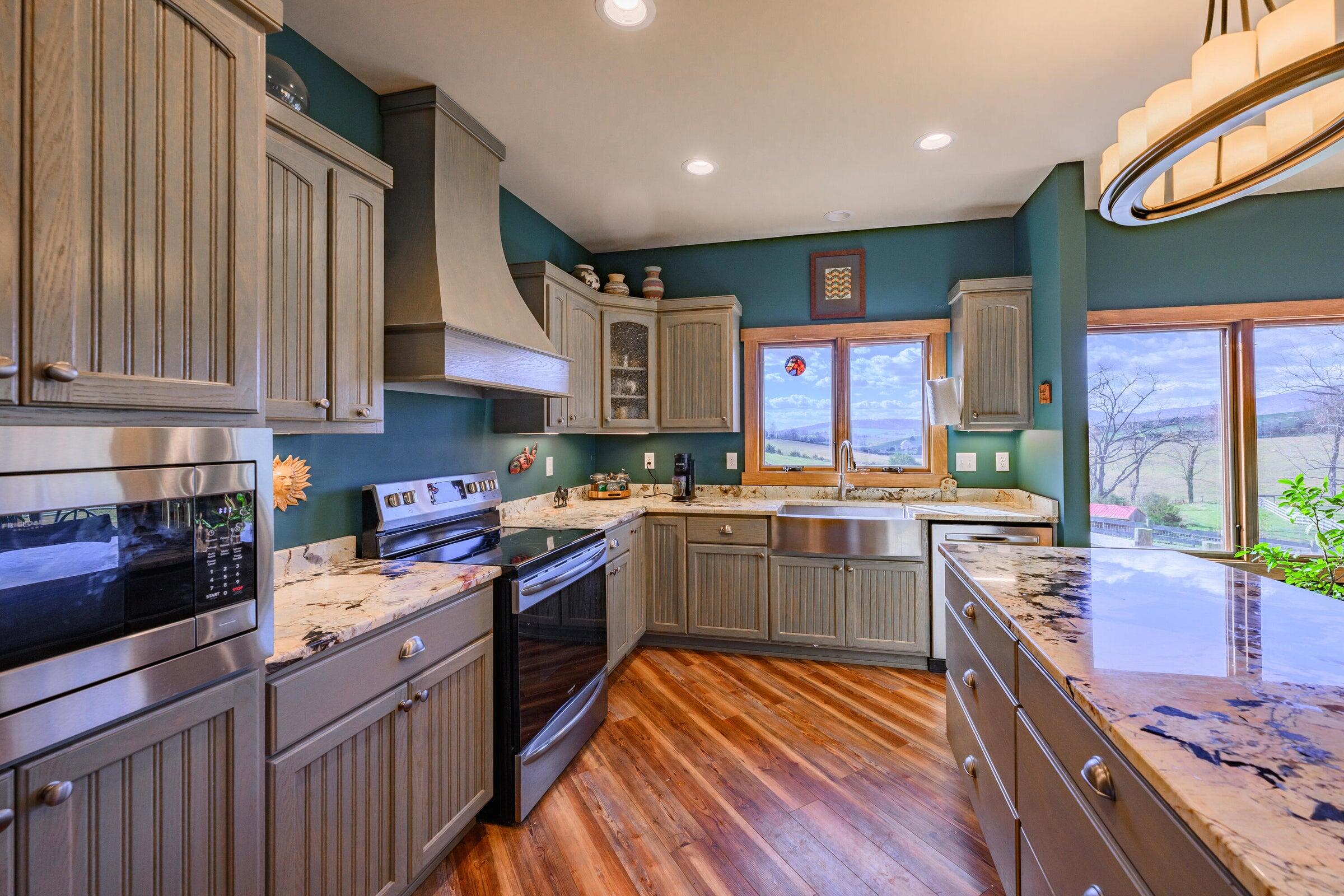747 New Providence Road Raphine, VA 24472 - Photo 23 of 46 a kitchen with stainless steel appliances granite countertop wooden cabinets a sink and a stove