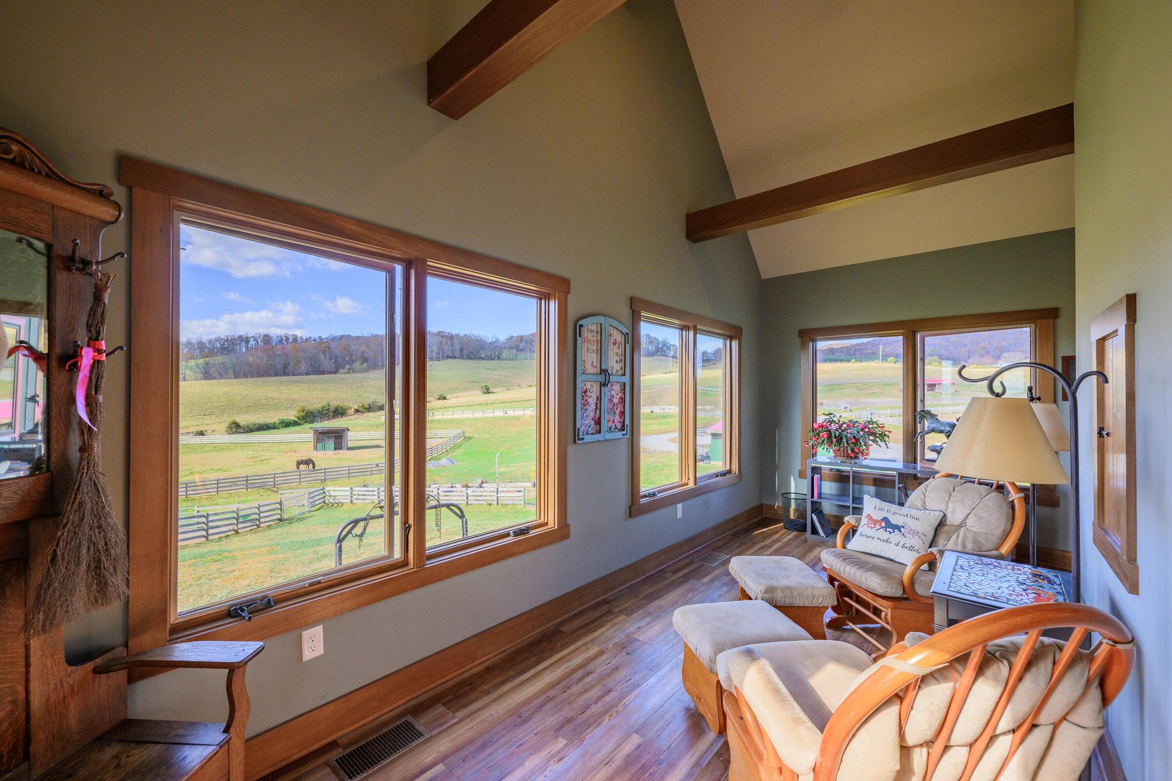 747 New Providence Road Raphine, VA 24472 - Photo 24 of 46 a living room with furniture and large windows