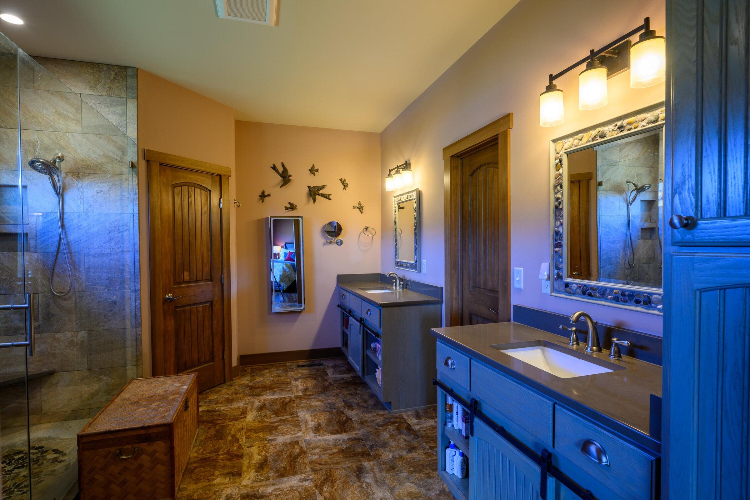 747 New Providence Road Raphine, VA 24472 - Photo 33 of 46 a spacious bathroom with a granite countertop sink and a mirror