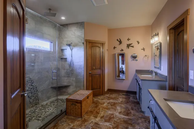 a work room with furniture a rug and a flat screen tv