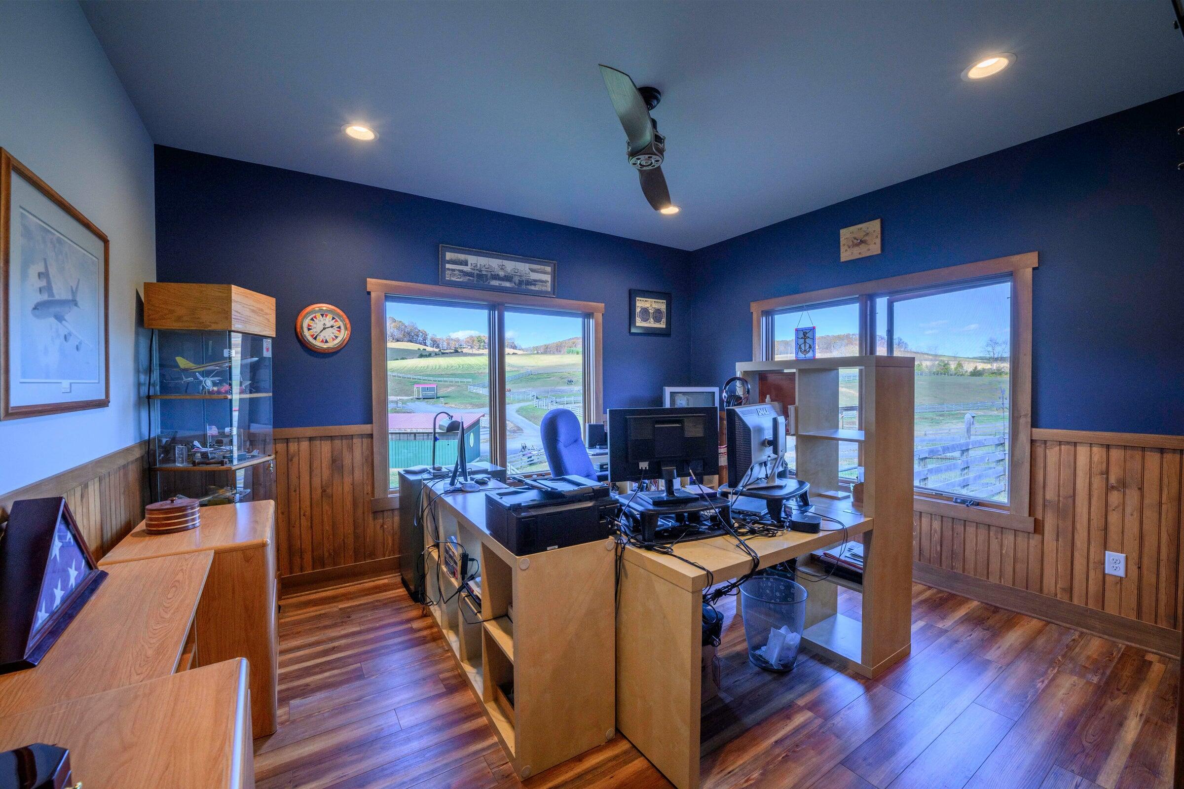 747 New Providence Road Raphine, VA 24472 - Photo 35 of 46 a work room with furniture a rug and a flat screen tv