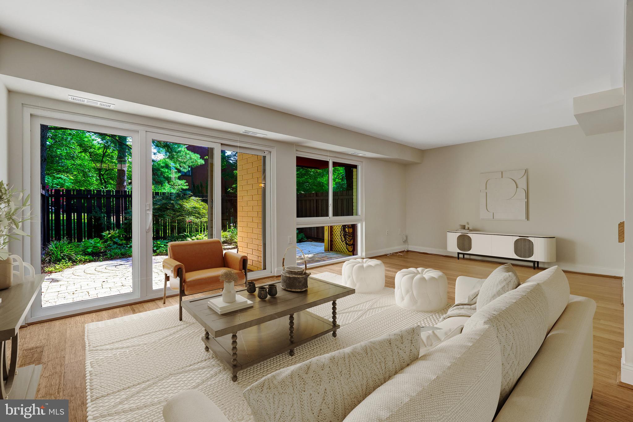 11136 Saffold Way Reston, VA 20190 - Photo 18 of 49 a living room with furniture and a large window