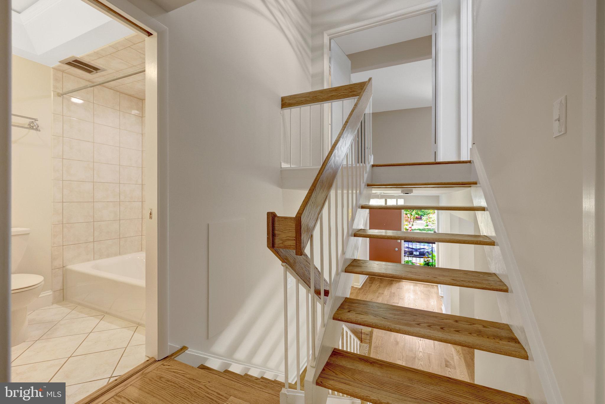 11136 Saffold Way Reston, VA 20190 - Photo 20 of 49 a view of staircase with white walls and a window