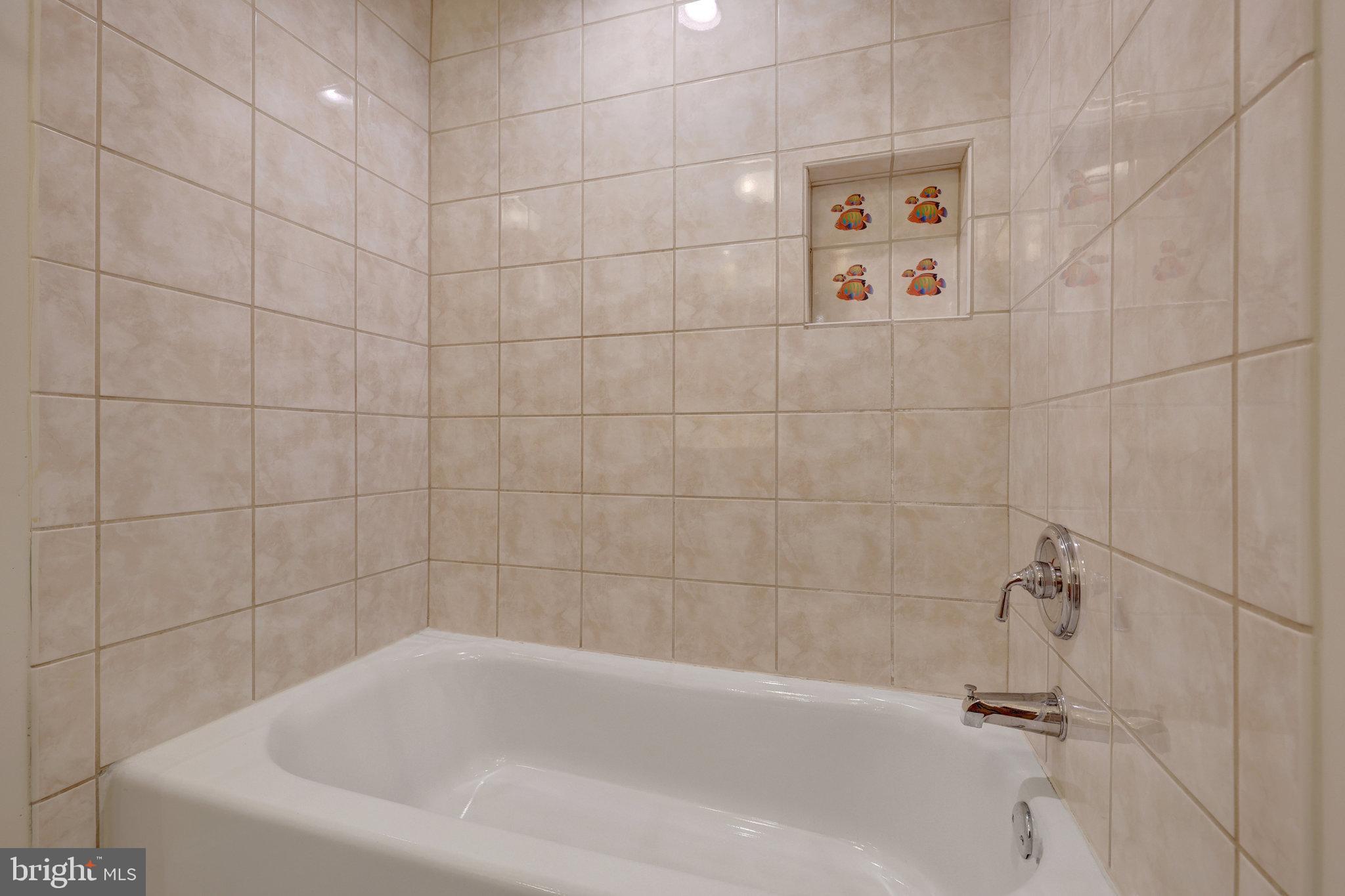 11136 Saffold Way Reston, VA 20190 - Photo 24 of 49 a bathroom with a bathtub