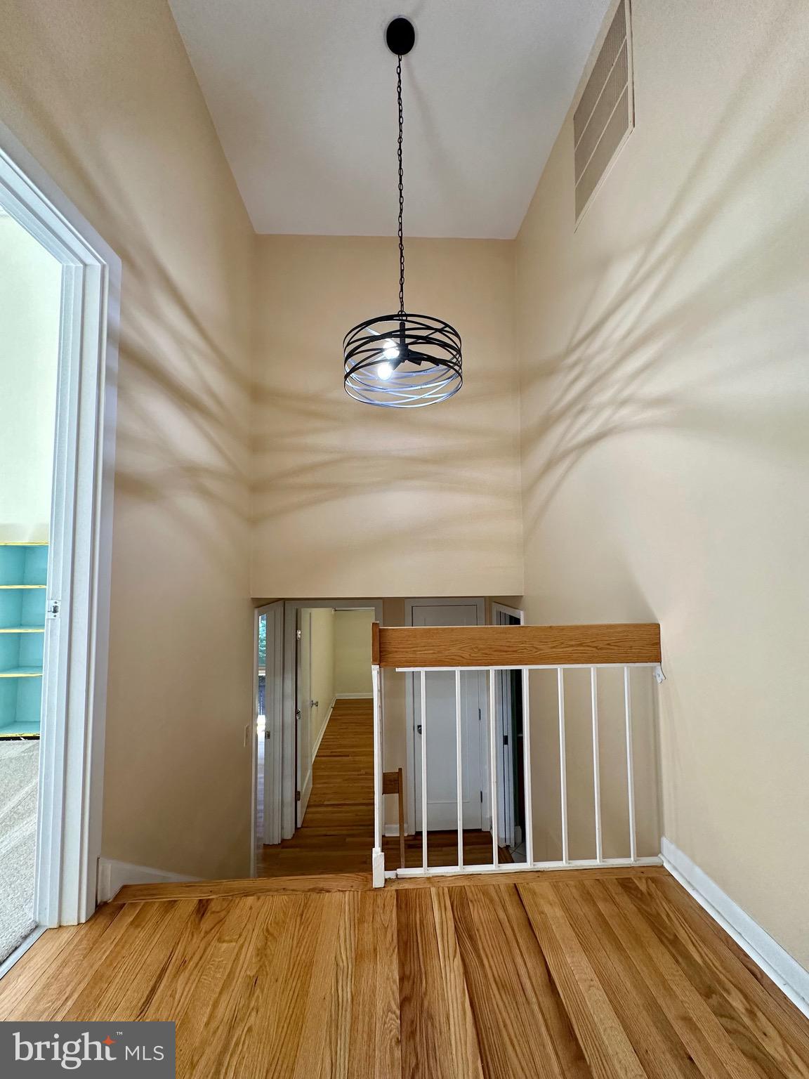 11136 Saffold Way Reston, VA 20190 - Photo 25 of 49 a view of a room with wooden floor and windows