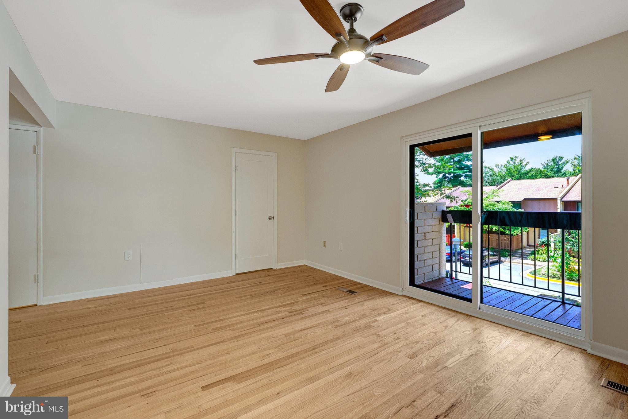 11136 Saffold Way Reston, VA 20190 - Photo 28 of 49 wooden floor in an empty room with a window