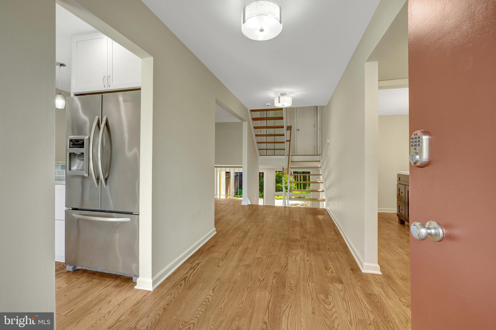 11136 Saffold Way Reston, VA 20190 - Photo 3 of 49 a view of kitchen with furniture and wooden floor