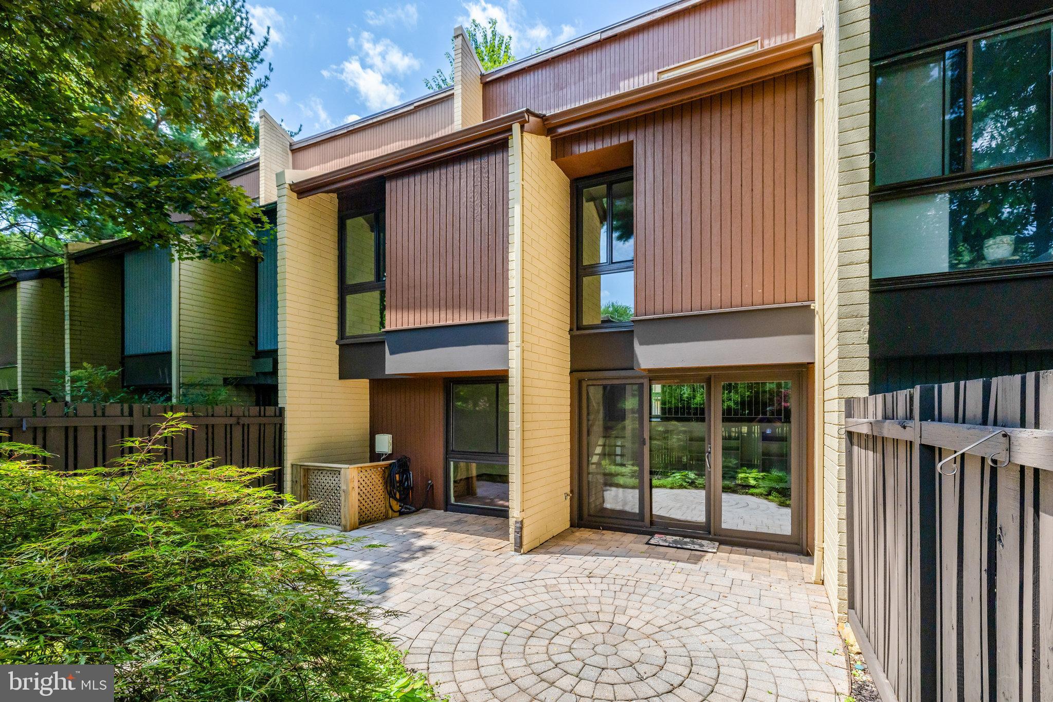 11136 Saffold Way Reston, VA 20190 - Photo 40 of 49 a view of a house with a porch and furniture