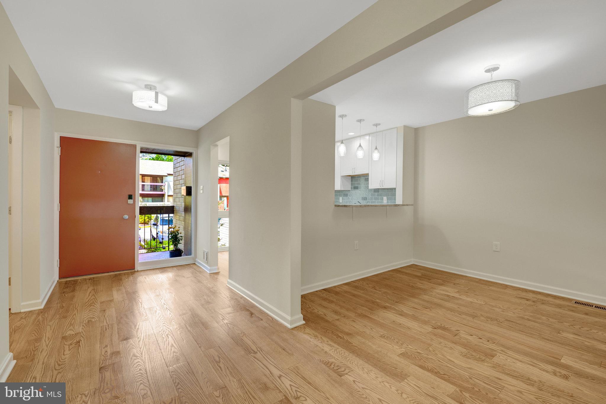 11136 Saffold Way Reston, VA 20190 - Photo 4 of 49 wooden floor in an empty room with a window