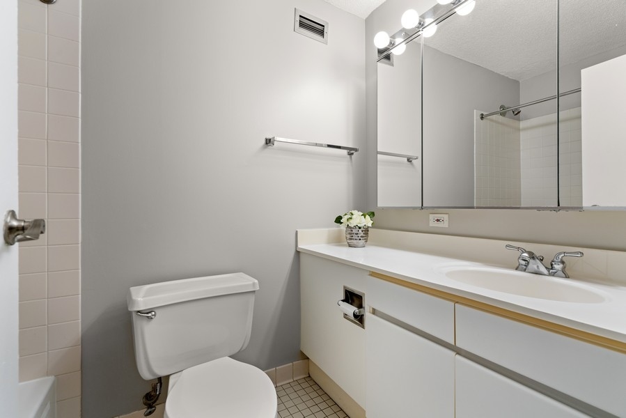 440 North Wabash Avenue, Unit 4706 Chicago, IL 60611 - Photo 17 of 29 a bathroom with a sink a toilet and shower