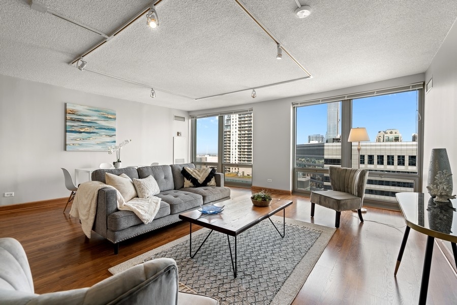 440 North Wabash Avenue, Unit 4706 Chicago, IL 60611 - Photo 3 of 29 a living room with furniture and a table