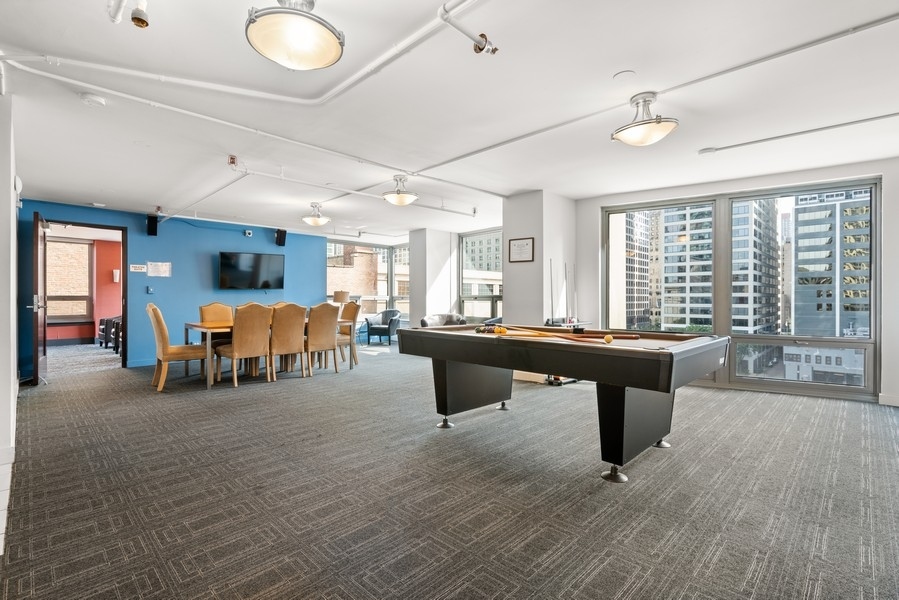 440 North Wabash Avenue, Unit 4706 Chicago, IL 60611 - Photo 22 of 29 a room with furniture and a large window