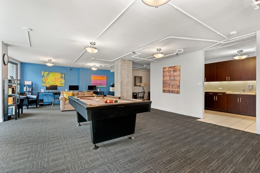 440 North Wabash Avenue, Unit 4706 Chicago, IL 60611 - Photo 23 of 29 a living room with furniture and a flat screen tv