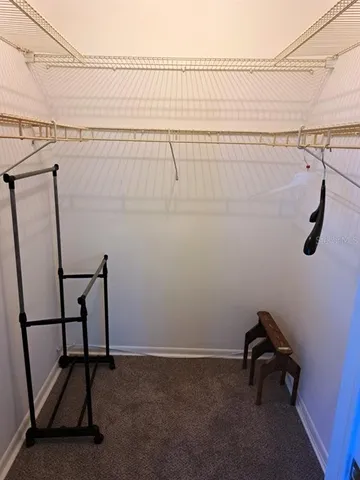 a bathroom with a sink and a wooden floor