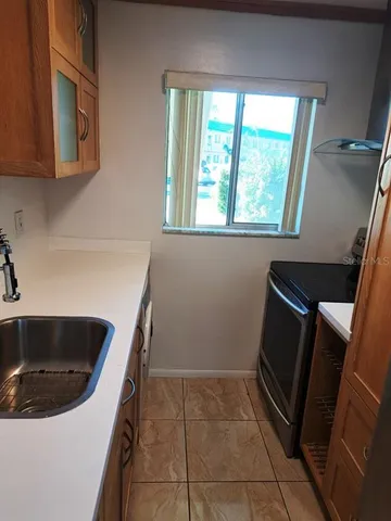 a kitchen with a sink and washing machine