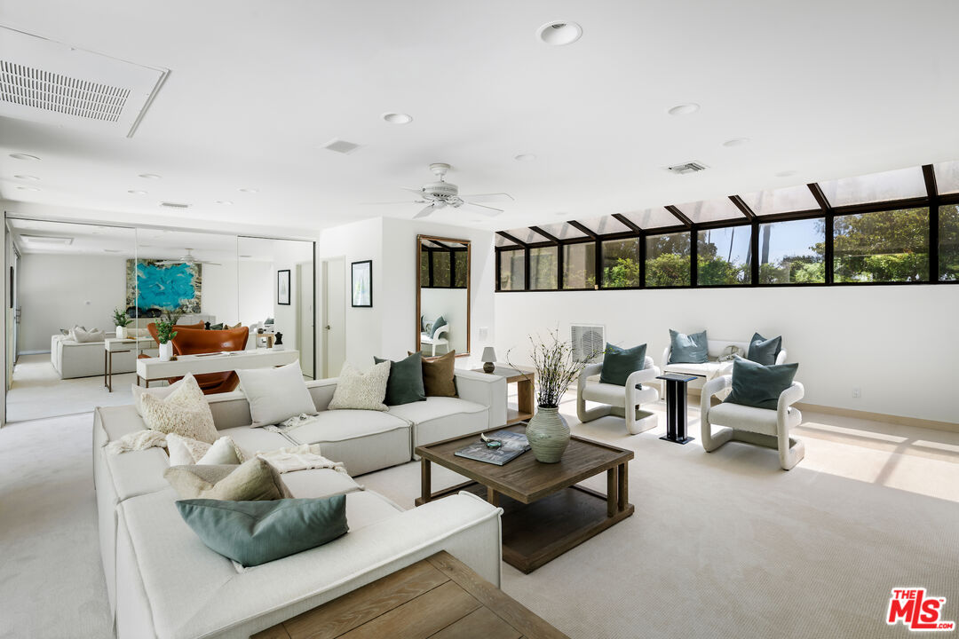 811 North Hillcrest Road Beverly Hills, CA 90210 - Photo 16 of 28 a living room with furniture