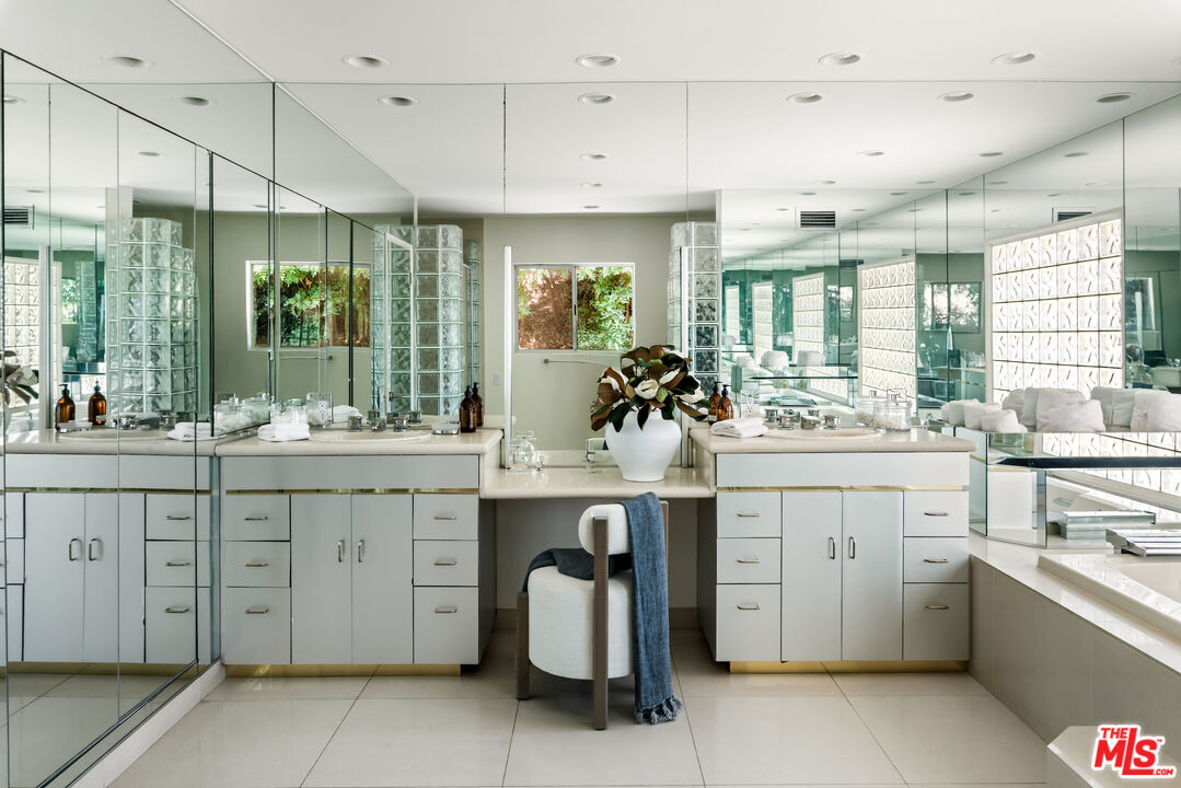 811 North Hillcrest Road Beverly Hills, CA 90210 - Photo 22 of 28 a view of cabinets a sink and a window in a room